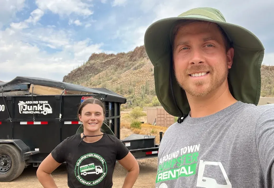 Garrett and Megan Frix with the dump trailer on a New River property clean-up