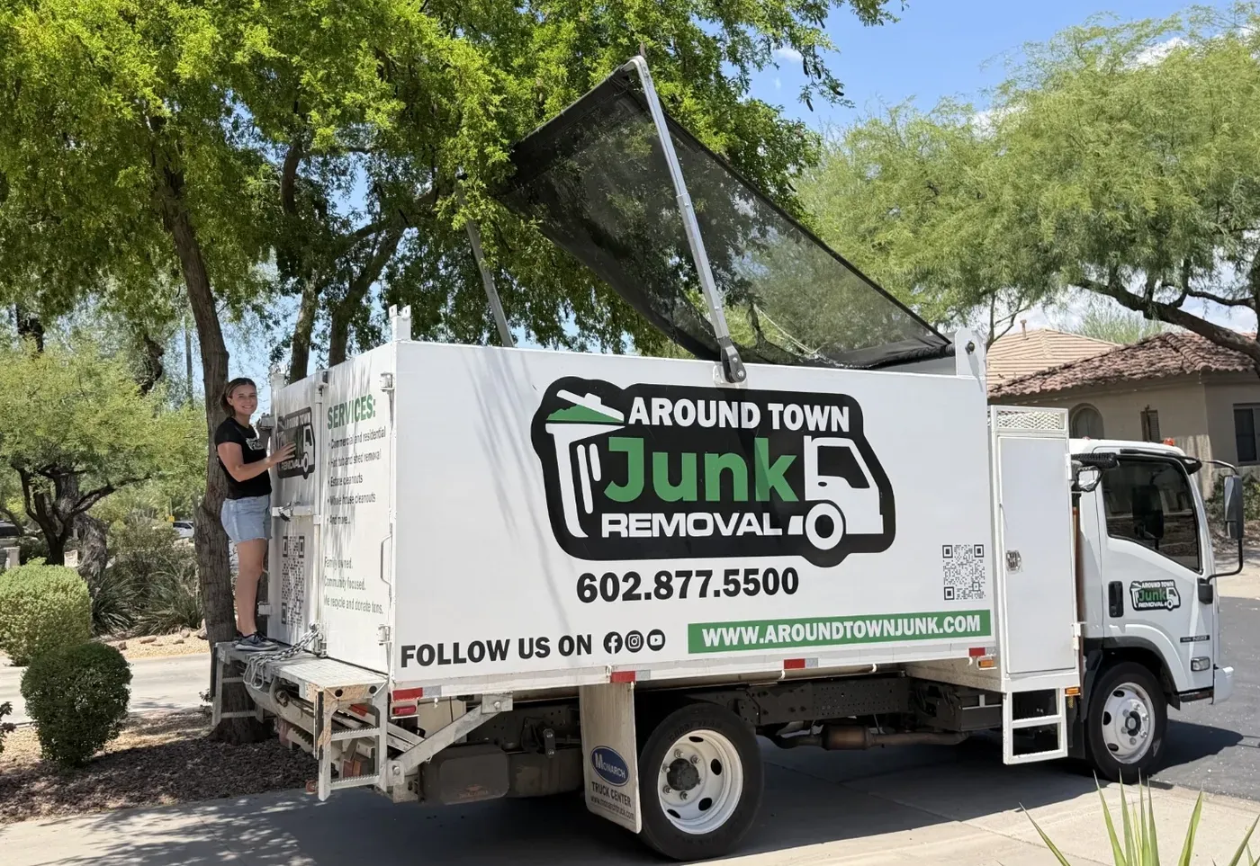 The Around Town box truck loaded with a large glass patio panel on a North Scottsdale street