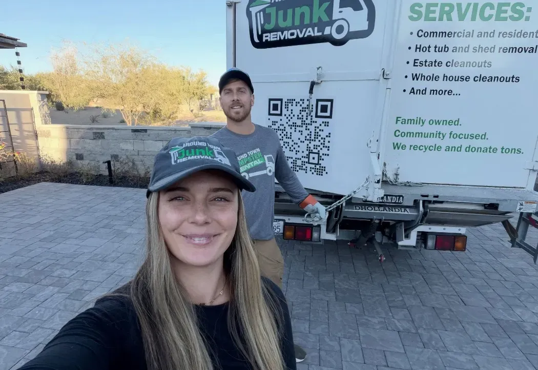 Garrett and Megan Frix with the truck on a house-flip clean-out in Troon