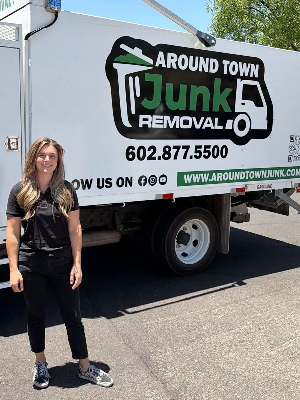 Megan in front of the Around Town Junk Removal truck