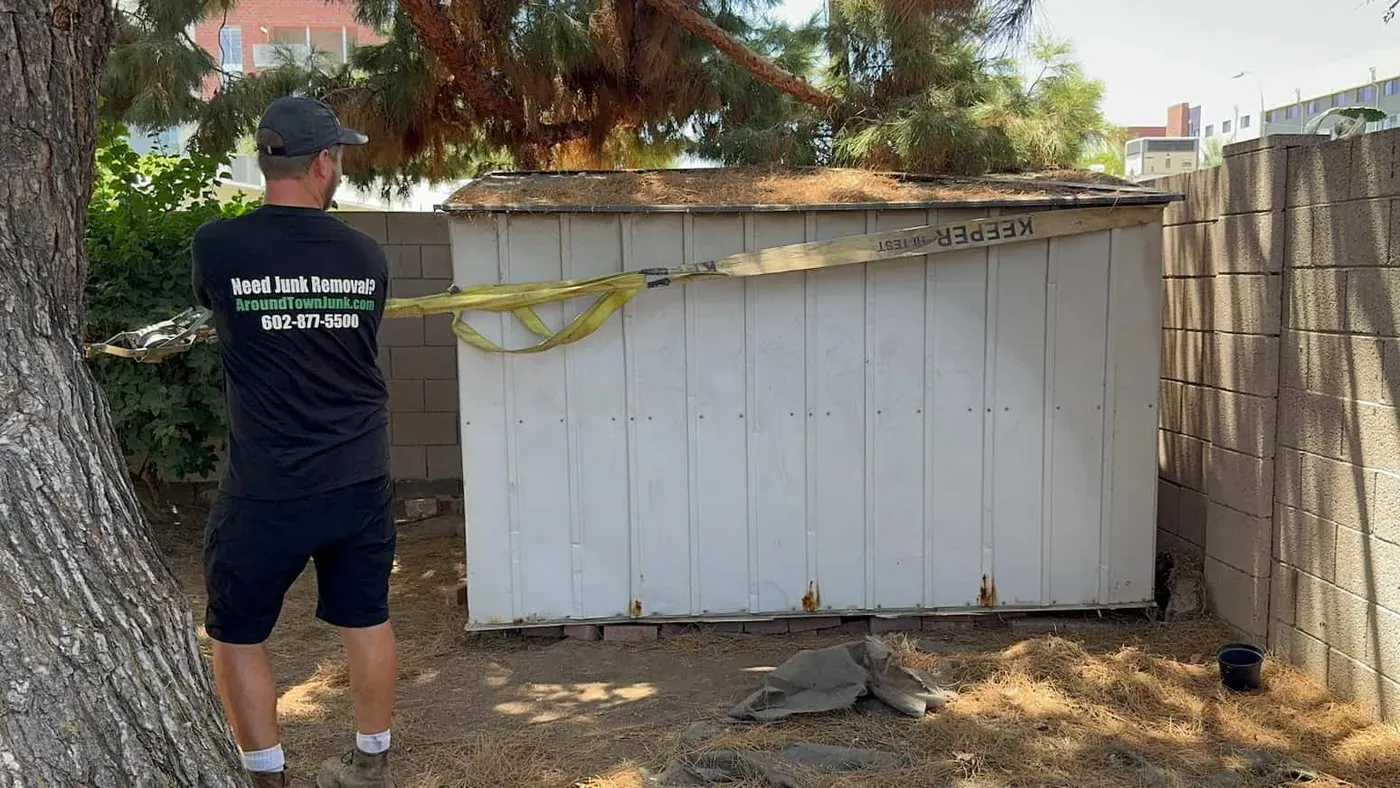 An old metal backyard shed before removal
